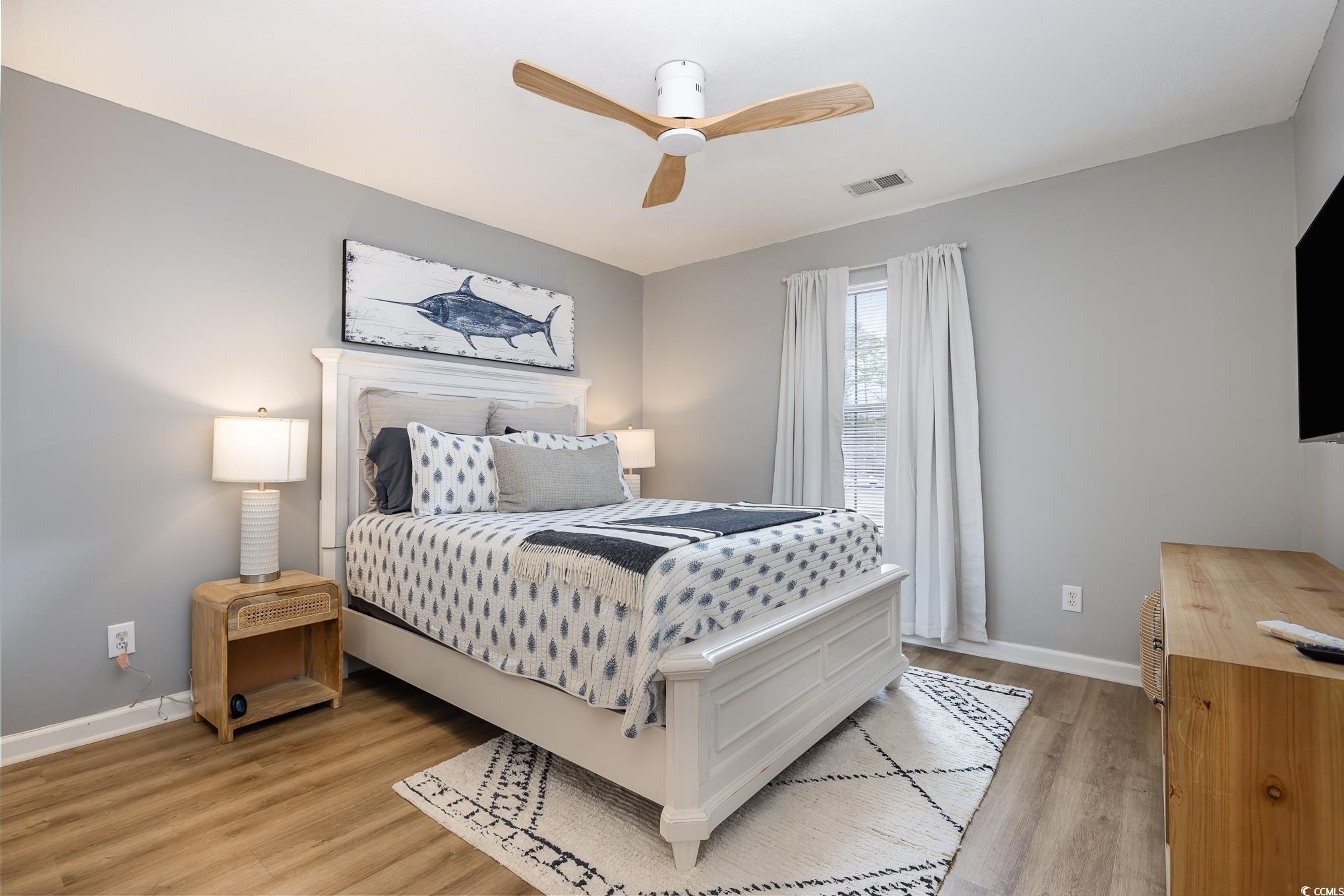 504 Pinehurst Lane, Unit 18H Pawleys Island, SC 29585 - Photo 4 of 28 Bedroom featuring light wood finished floors and ceiling fan