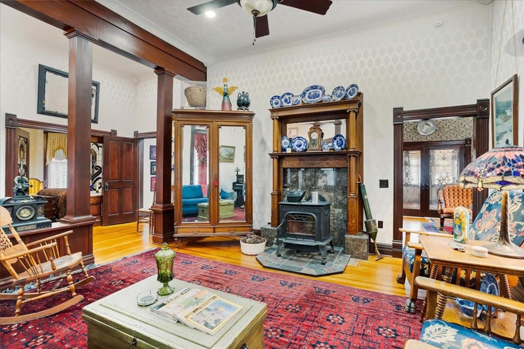 300 West 6th Street Bonham, TX 75418 - Photo 12 of 40 a living room with furniture a piano and a flat screen tv