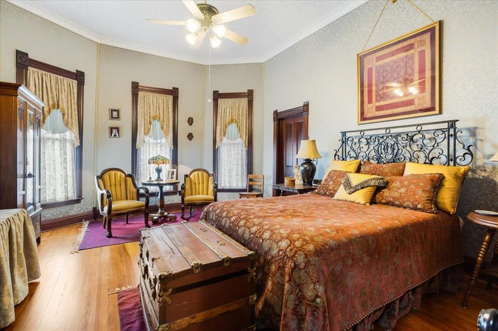 300 West 6th Street Bonham, TX 75418 - Photo 13 of 40 a bed room with a bed and chair