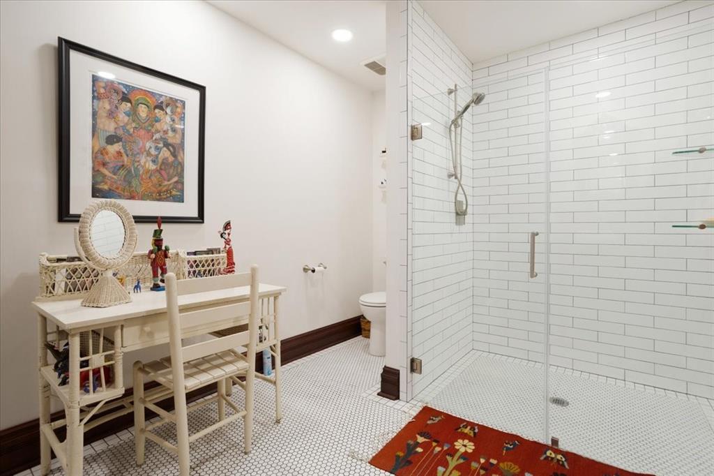300 West 6th Street Bonham, TX 75418 - Photo 17 of 40 a bathroom with a sink and a mirror