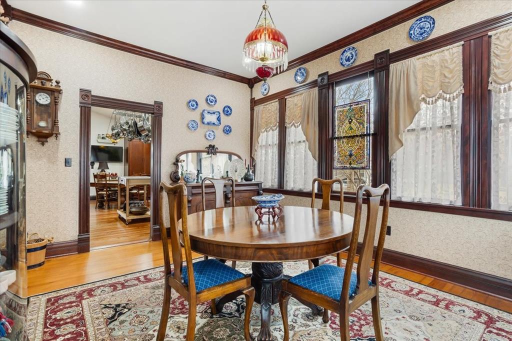 300 West 6th Street Bonham, TX 75418 - Photo 23 of 40 a dining room with furniture window and wooden floor