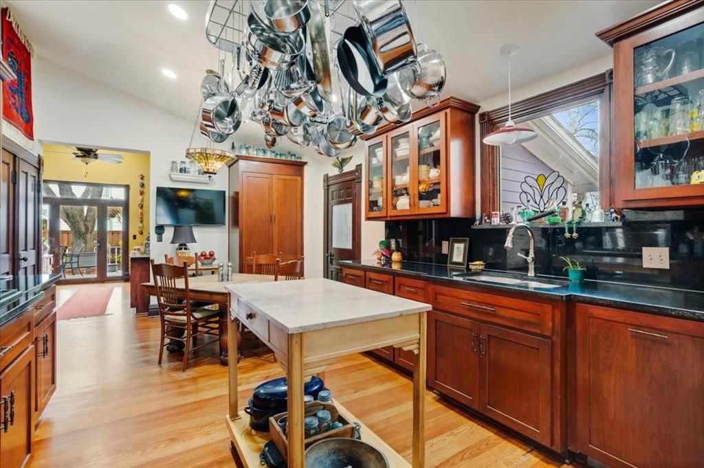 300 West 6th Street Bonham, TX 75418 - Photo 24 of 40 a view of a dining room with furniture chandelier and wooden floor