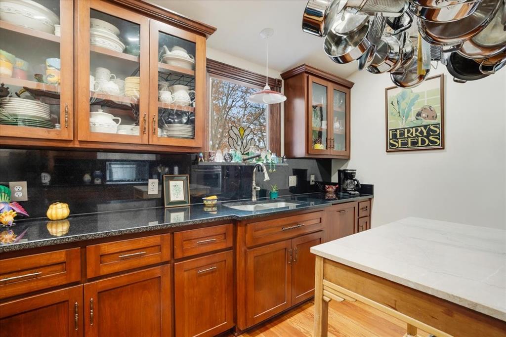 300 West 6th Street Bonham, TX 75418 - Photo 32 of 40 a kitchen with stainless steel appliances granite countertop a sink a stove and cabinets