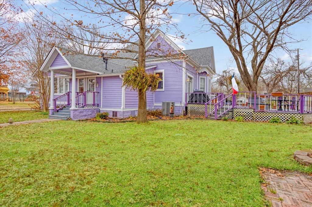 300 West 6th Street Bonham, TX 75418 - Photo 40 of 40 a front view of house with yard and seating area