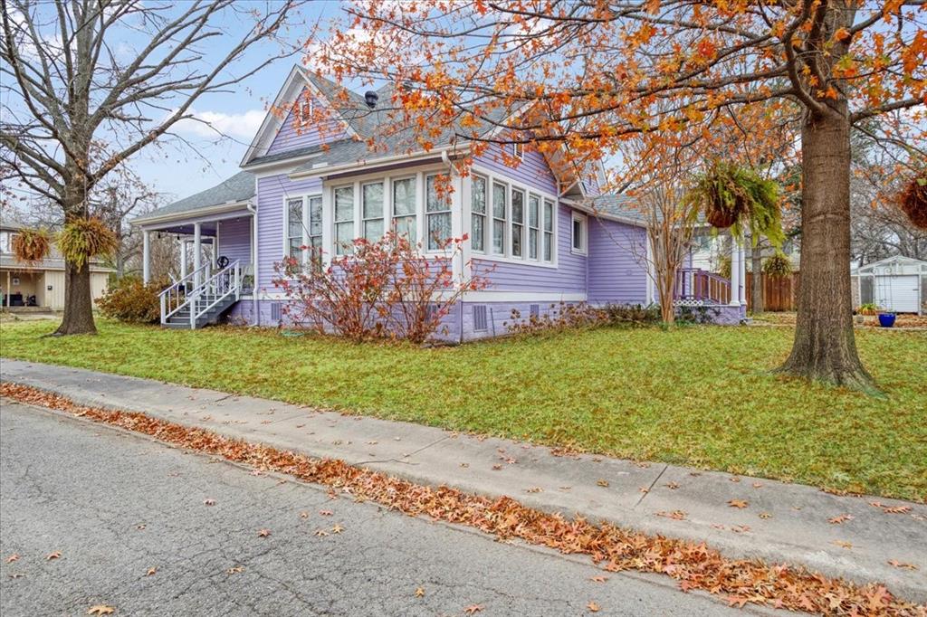 300 West 6th Street Bonham, TX 75418 - Photo 7 of 40 a front view of house with yard and green space