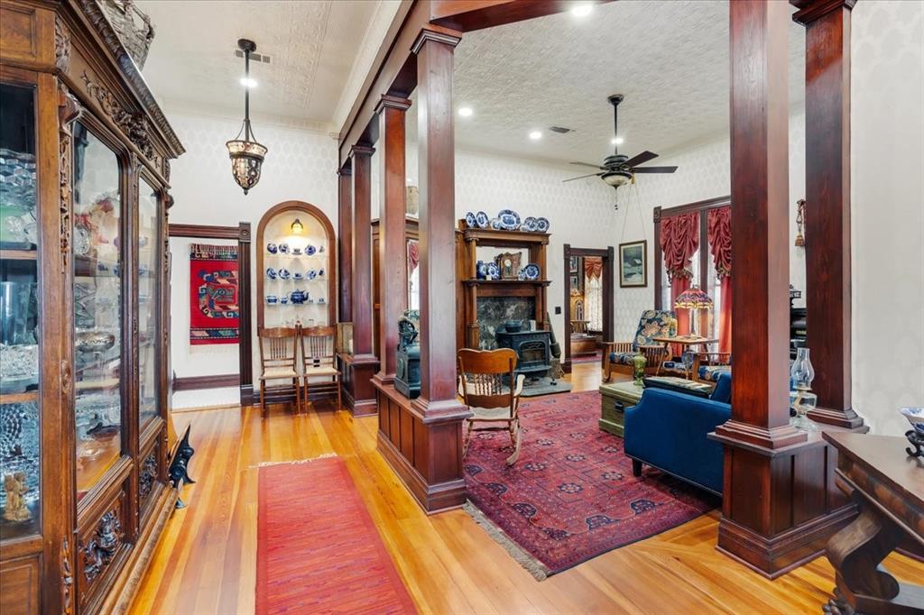 300 West 6th Street Bonham, TX 75418 - Photo 9 of 40 a living room with furniture rug and wooden floor