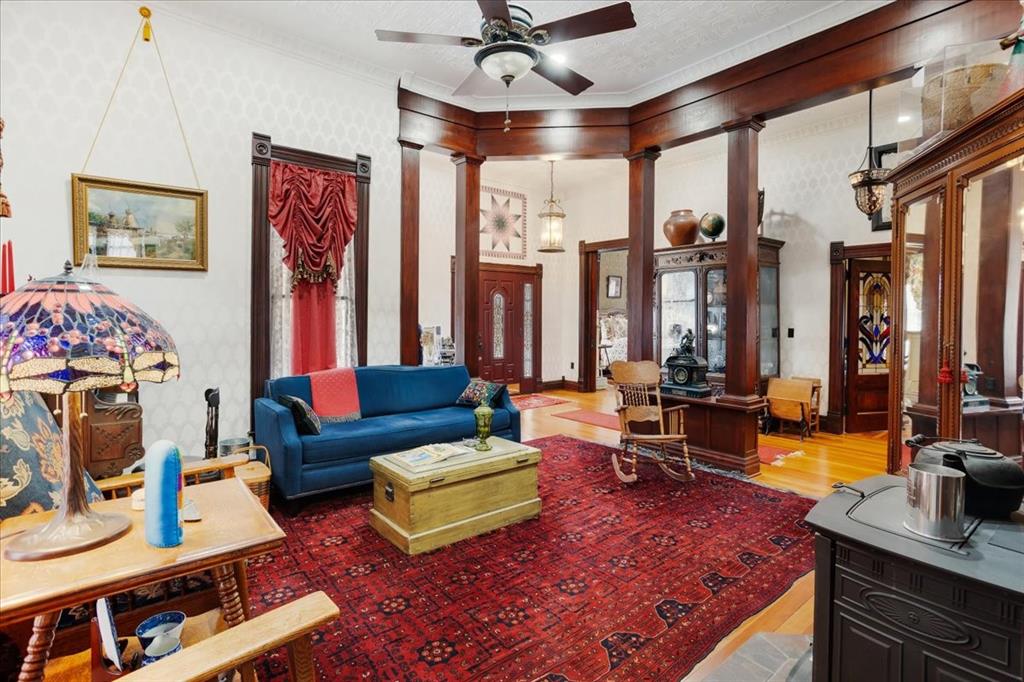 300 West 6th Street Bonham, TX 75418 - Photo 10 of 40 a living room with furniture a rug and a large window