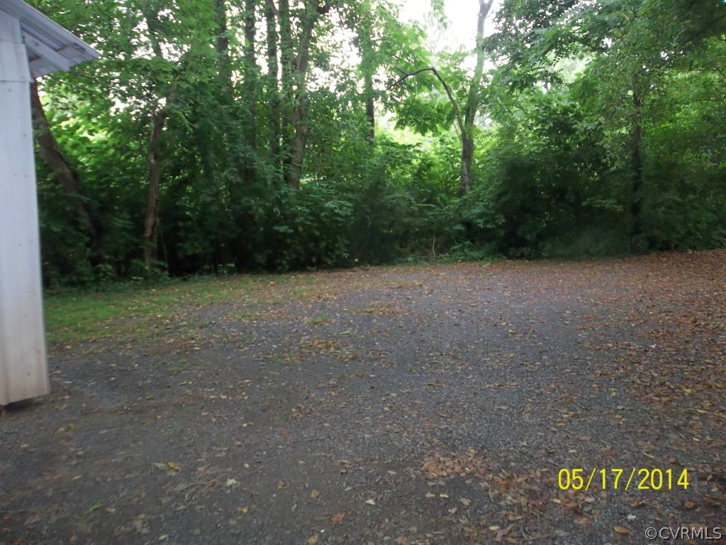 4286 Oak Hill Road Buckingham, VA 23921 - Photo 12 of 13 a view of a field with trees in the background