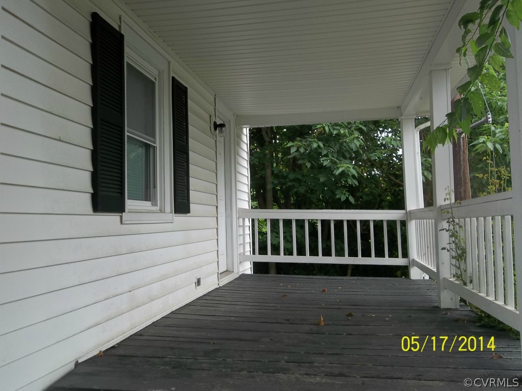 4286 Oak Hill Road Buckingham, VA 23921 - Photo 10 of 13 a view of porch with wooden floor and fence