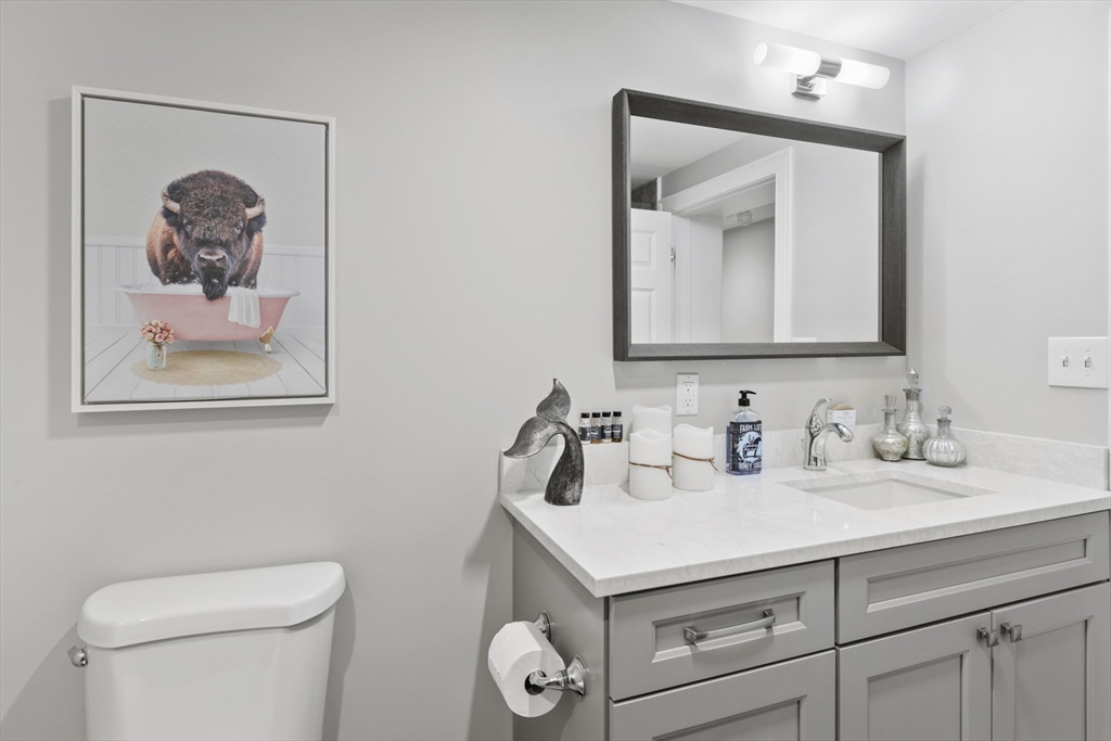 4 Wildmeadow Road Boxford, MA 01921 - Photo 24 of 42 a bathroom with a toilet sink and mirror