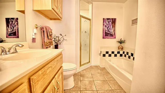 a spacious bathroom with a sink mirror and bathtub