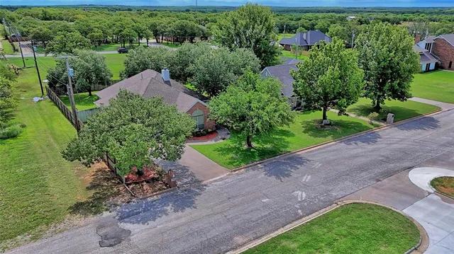 a view of a garden with a house