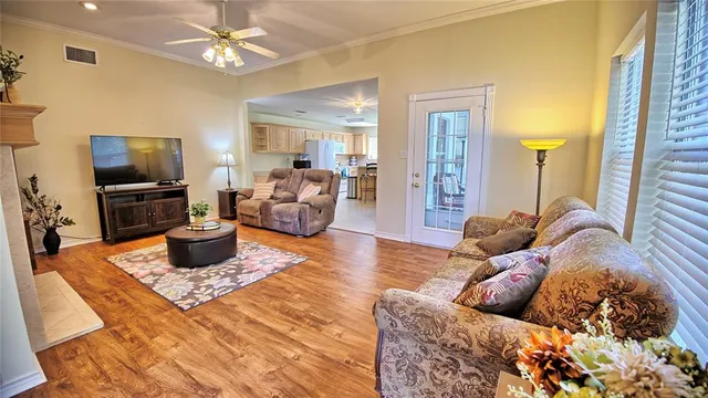 a living room with furniture fireplace and a flat screen tv