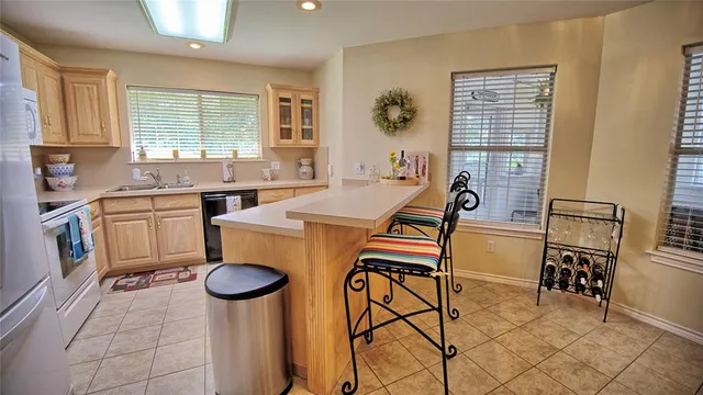 a view of a kitchen area with furniture and a window