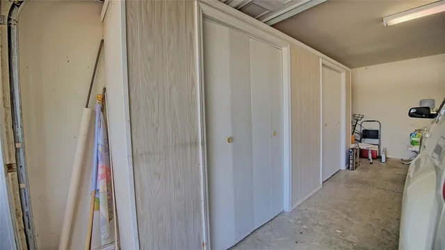 a view of a hallway with wooden floor and stairs