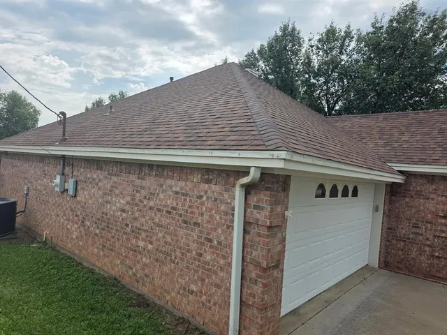 a front view of a house with garage