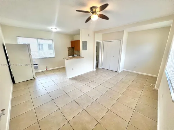 a view of kitchen with furniture and window