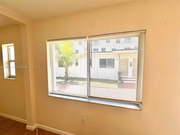 a view of a room that has a window