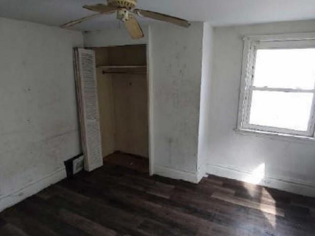 406 Grove Street McKees Rocks, PA 15136 - Photo 11 of 14 an empty room with wooden floor closet and windows