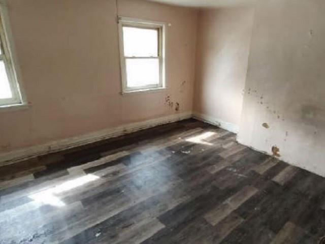 406 Grove Street McKees Rocks, PA 15136 - Photo 12 of 14 an empty room with wooden floor and windows