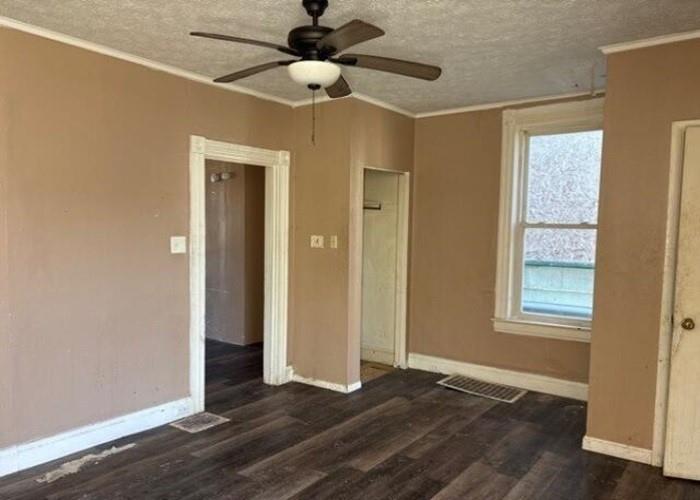 406 Grove Street McKees Rocks, PA 15136 - Photo 8 of 14 a view of an empty room with wooden floor and a window