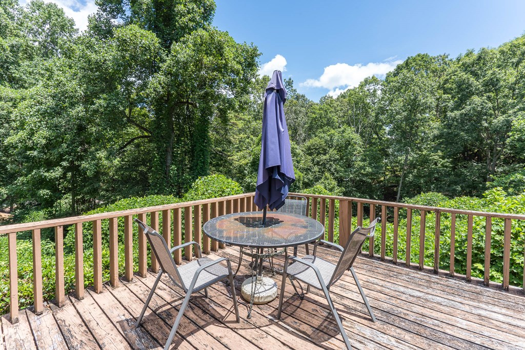 275 Village Road Murphy, NC 28906 - Photo 11 of 47 a view of a balcony with wooden floor and outdoor seating