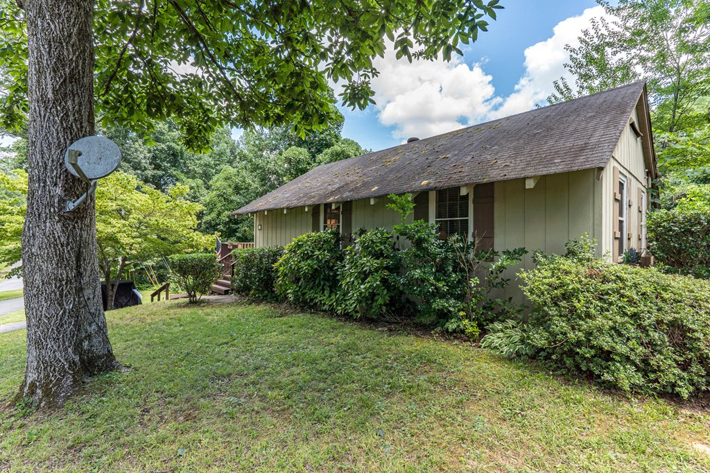 275 Village Road Murphy, NC 28906 - Photo 2 of 47 a view of a house with a yard and plants