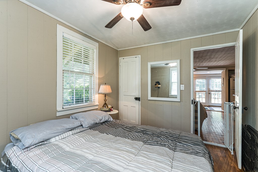 275 Village Road Murphy, NC 28906 - Photo 30 of 47 a bedroom with a large bed and a chandelier