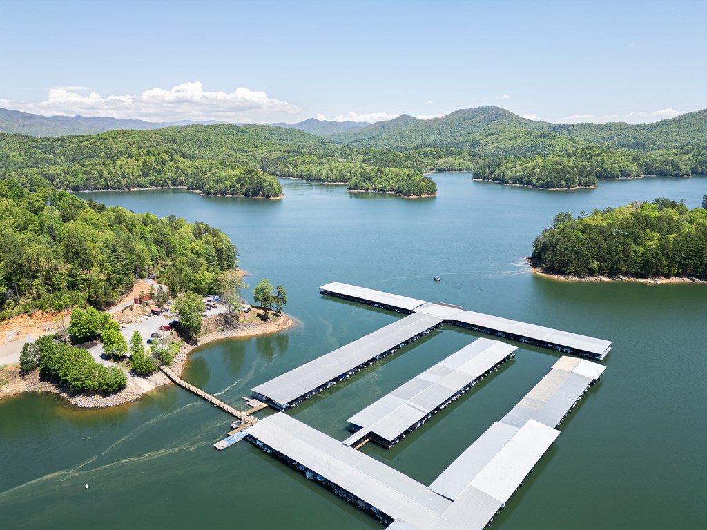 275 Village Road Murphy, NC 28906 - Photo 39 of 47 a view of a lake with a mountain