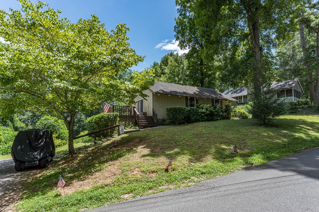 275 Village Road Murphy, NC 28906 - Photo 6 of 47 a view of a house with yard and a garden