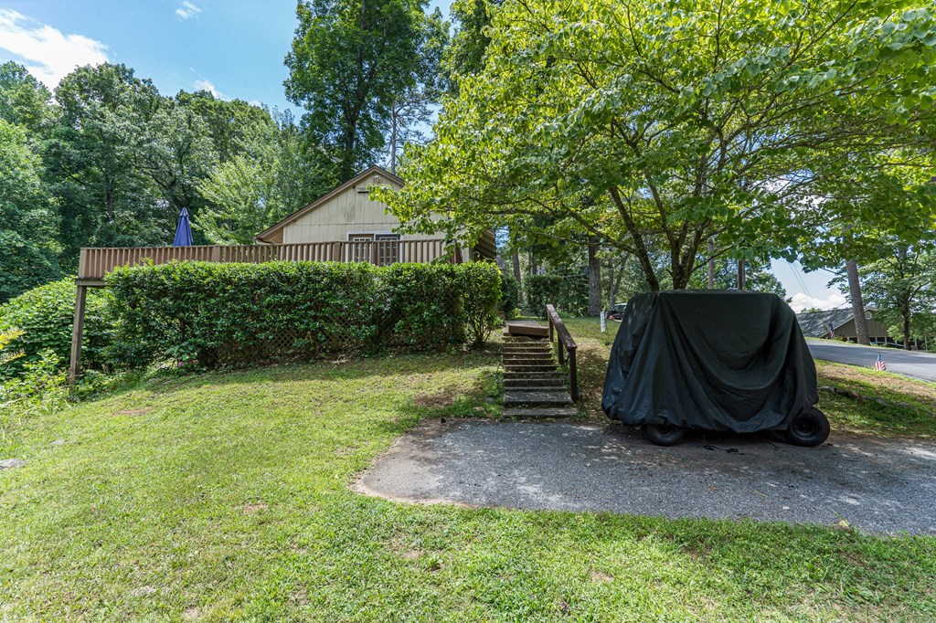 275 Village Road Murphy, NC 28906 - Photo 7 of 47 a view of backyard with large trees and a barn