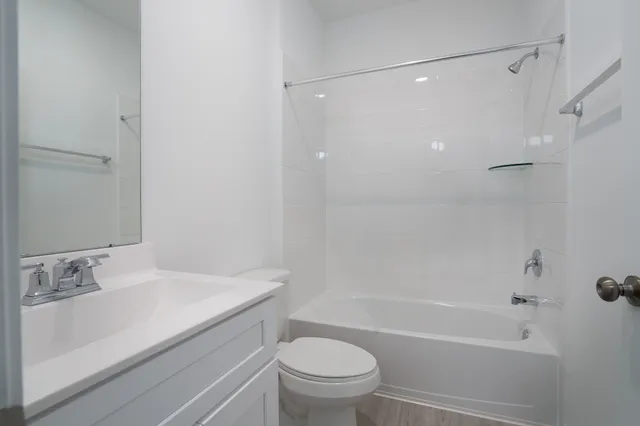 a bathroom with a sink a toilet and a bathtub