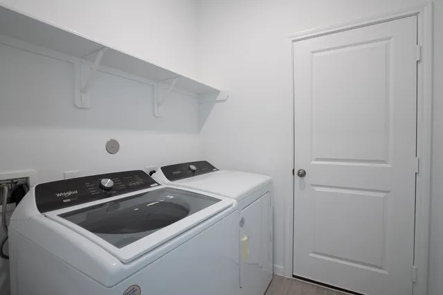 a utility room with dryer and washer