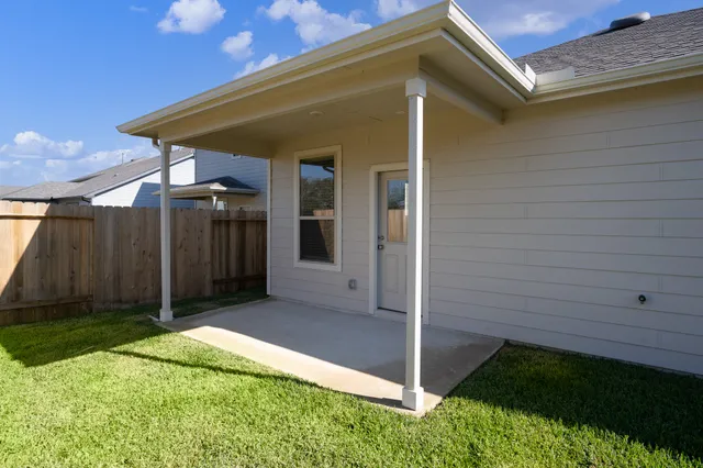 a backyard of a house with lots of green space