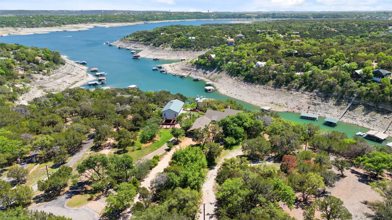 an aerial view of a houses with a lake view