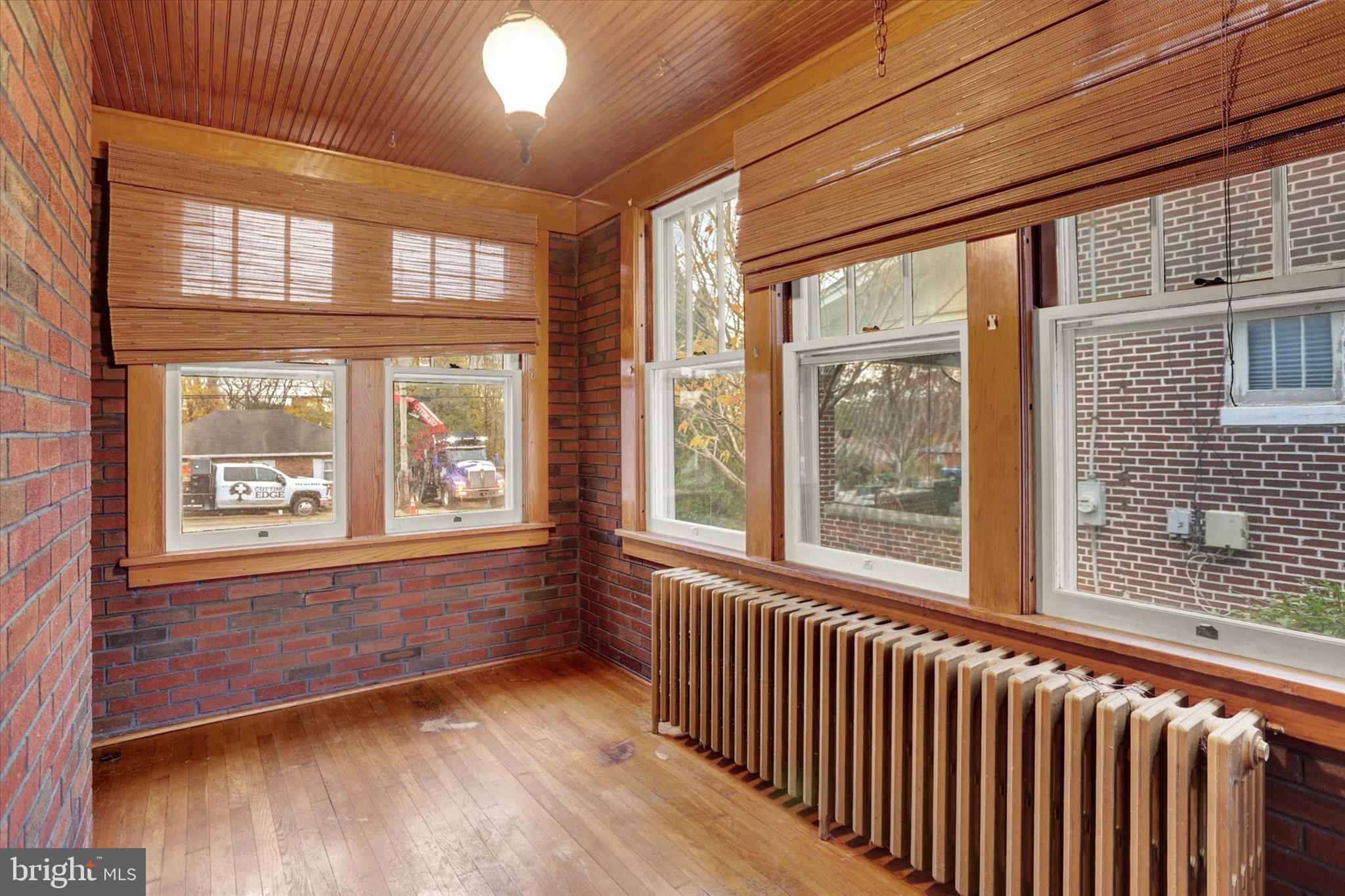 711 Pine Street Steelton, PA 17113 - Photo 11 of 37 a view of an empty room with wooden floor and a window