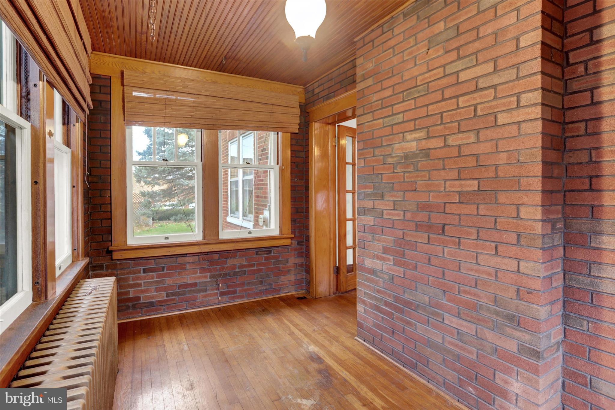 711 Pine Street Steelton, PA 17113 - Photo 12 of 37 a view of empty room with wooden floor and fan