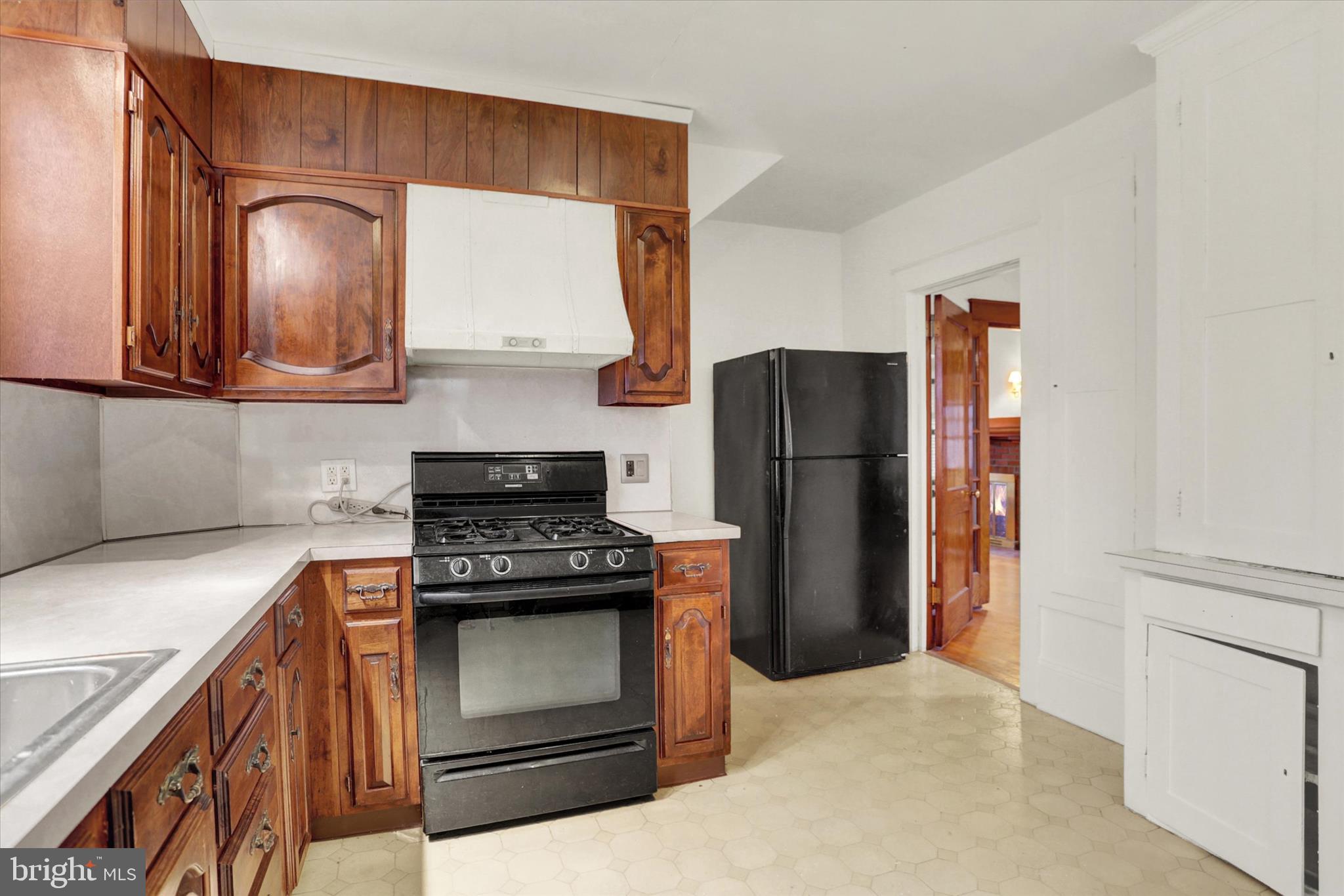711 Pine Street Steelton, PA 17113 - Photo 13 of 37 a kitchen with a stove microwave and refrigerator