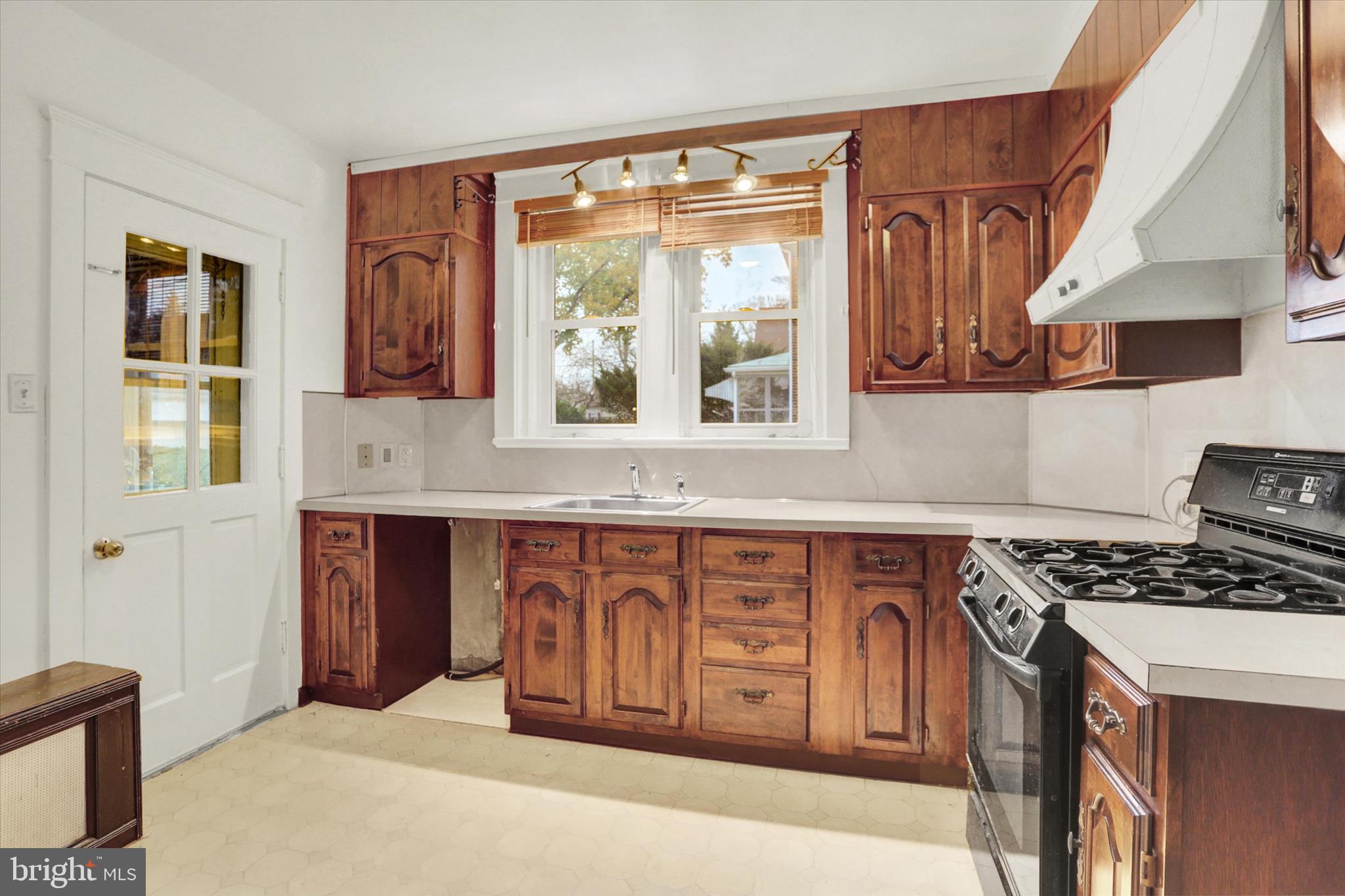 711 Pine Street Steelton, PA 17113 - Photo 15 of 37 a kitchen with stainless steel appliances granite countertop a stove a sink and a microwave