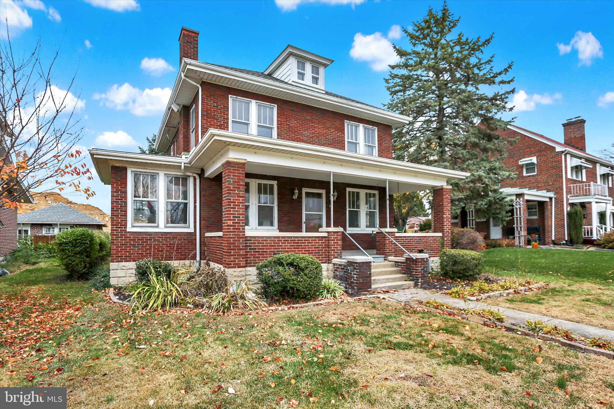 711 Pine Street Steelton, PA 17113 - Photo 2 of 37 front view of a brick house with a yard