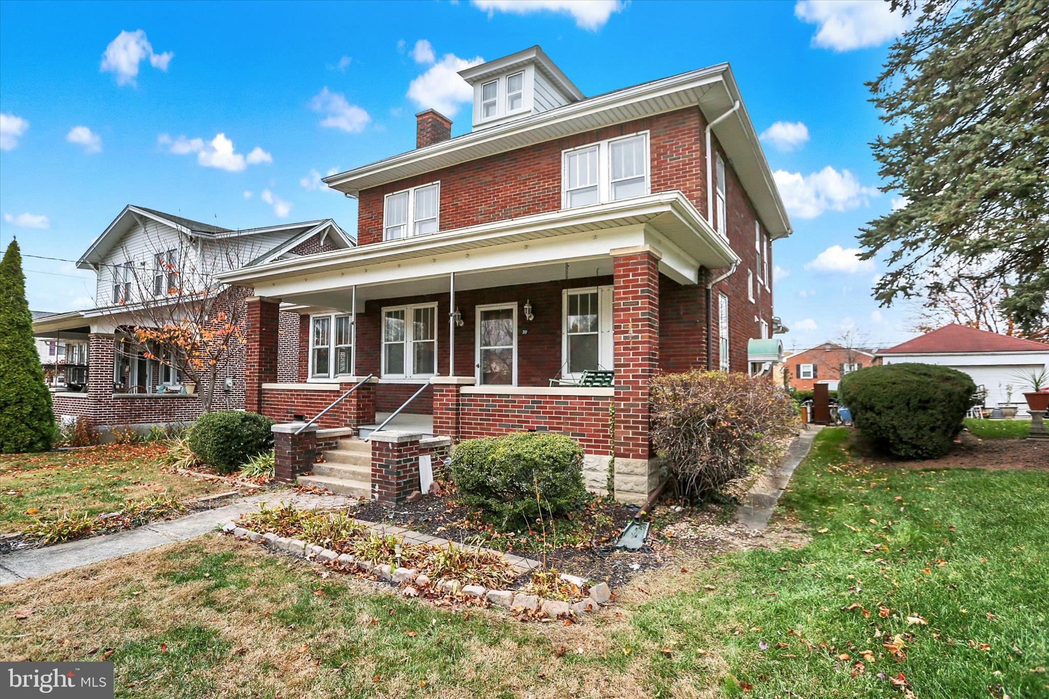711 Pine Street Steelton, PA 17113 - Photo 3 of 37 a front view of a house with garden