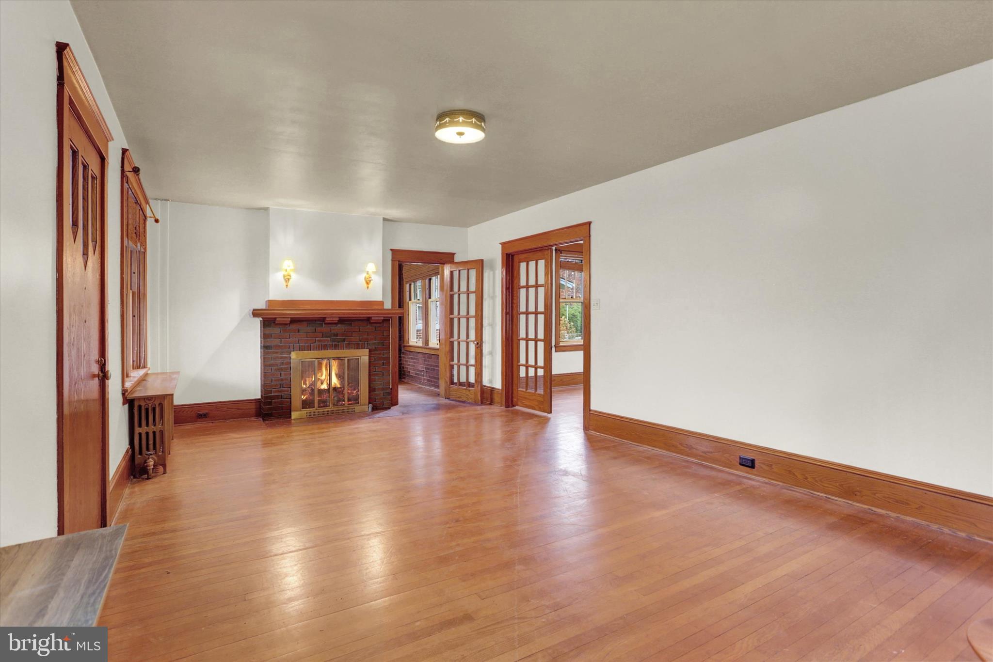 711 Pine Street Steelton, PA 17113 - Photo 7 of 37 a view of empty room with fireplace and wooden floor
