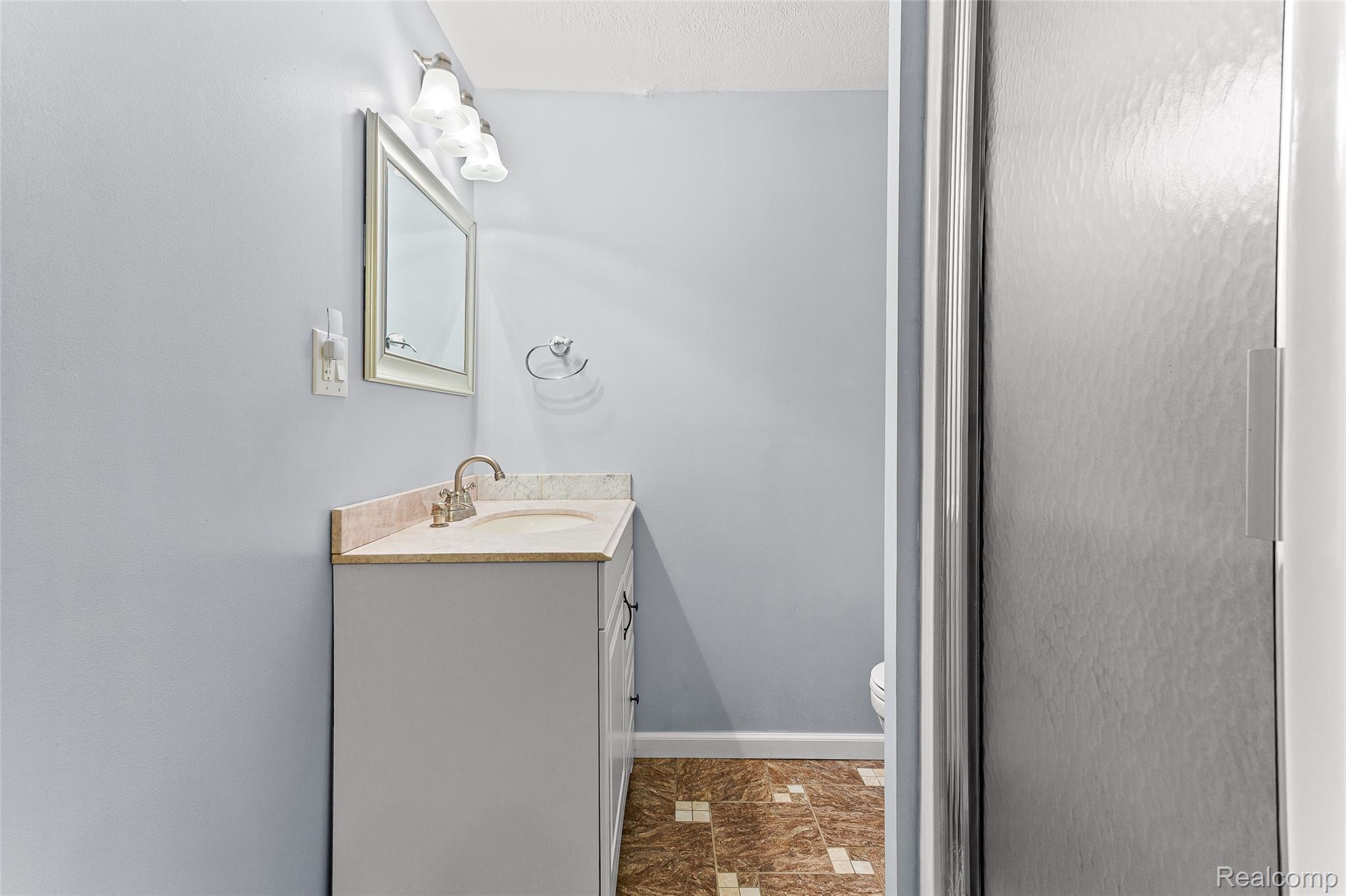 961 Jolly Road Okemos, MI 48864 - Photo 16 of 29 Bathroom with vanity and a shower stall