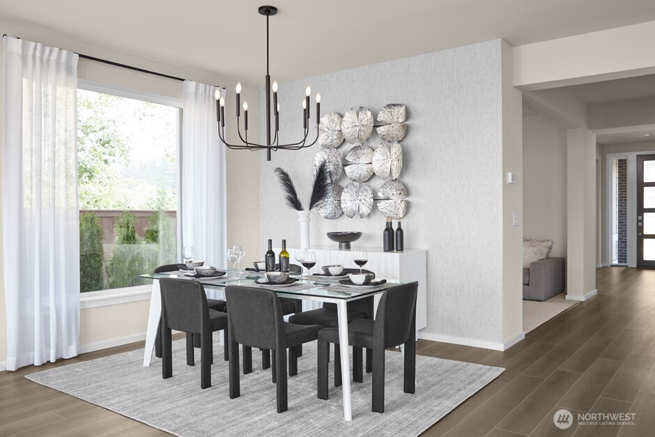 5725 160th Street Southwest Edmonds, WA 98026 - Photo 4 of 10 a view of a dining room with furniture window and wooden floor
