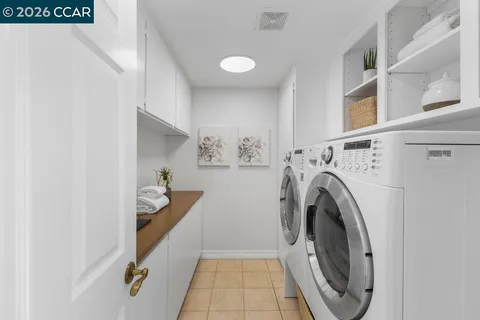 a bedroom with a bed table and a couch