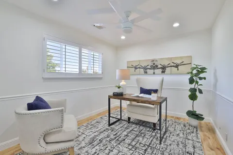 a living room with furniture and a rug