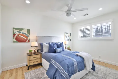 a bedroom with bed and window