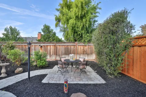 a view of outdoor sitting area with furniture