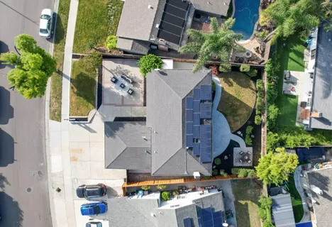 an aerial view of residential houses with outdoor space