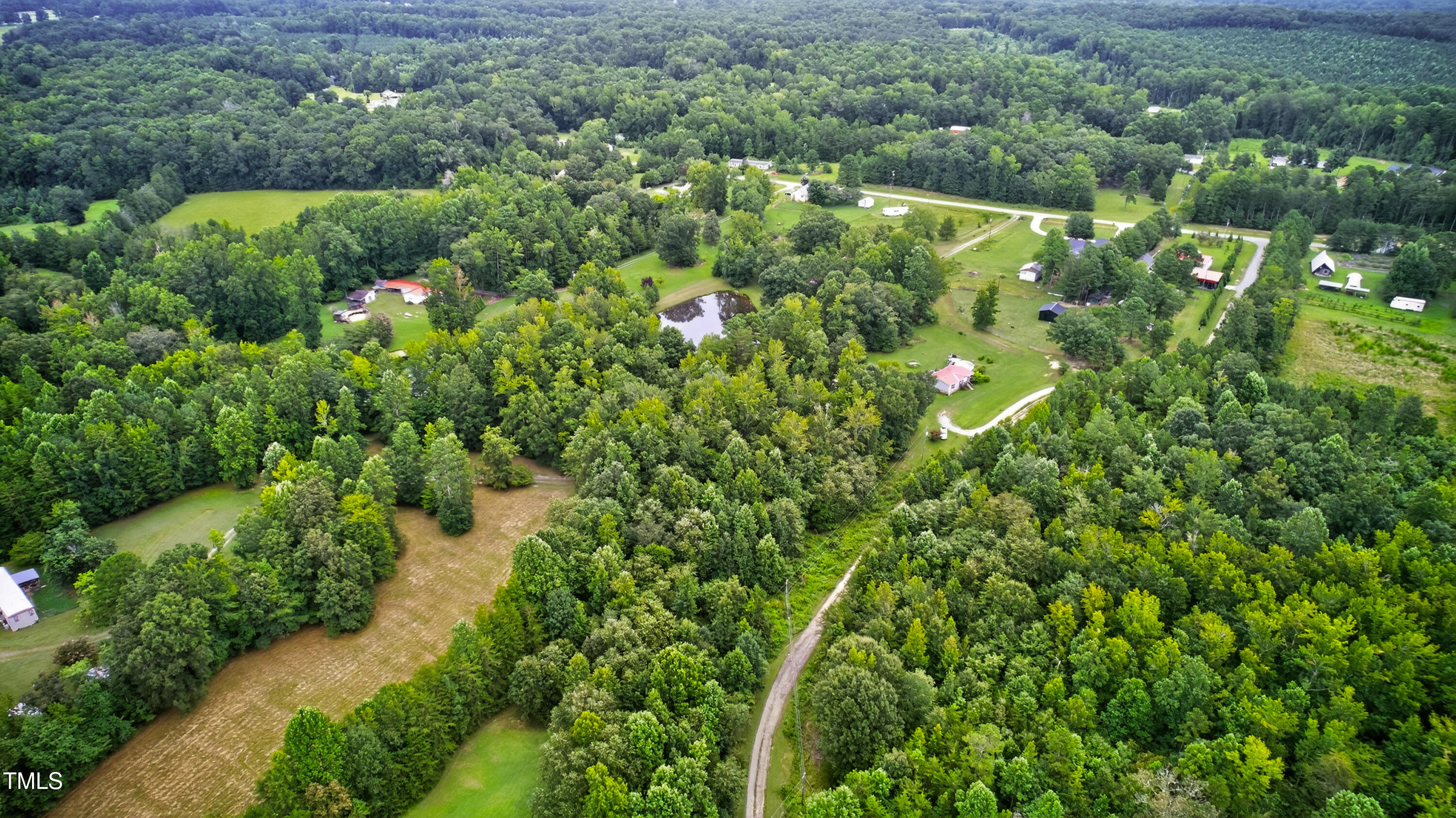 0 Thompson Mill Road Graham, NC 27253 - Photo 15 of 19 an aerial view of residential houses with outdoor space and trees